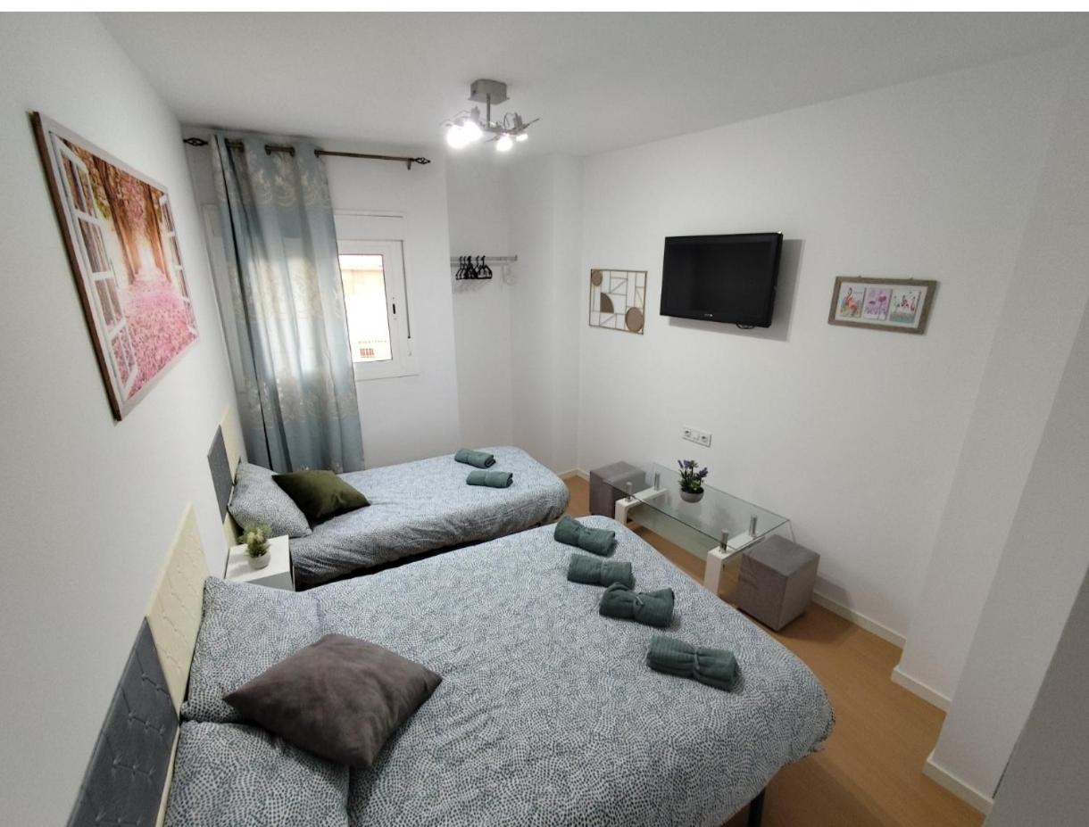 Allotjament en família Triple Con Bano Compartido Lovely Sevilla Camas